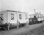 Trucks Hauling Prefabricated Building Parts by East Texas State Teachers College