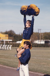 Cheerleader with Pom-poms by East Texas State University
