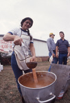 Woman Ladling Chili by East Texas State University