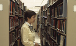 Student in James G. Gee Library by East Texas State University
