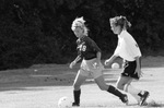 Soccer Player Kicking the Ball by East Texas State University