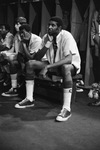 Seated Basketball Player in Locker Room by East Texas State University