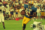 Raymond McGuire Running with Ball by East Texas State University