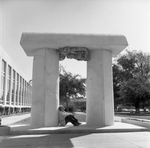 Person Sitting Under the Arch by East Texas State University