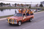 Chi Omega Fraternity Members Waving During Parade by East Texas State University