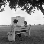 Students on Bench with Whitley Residence Hall by East Texas State University