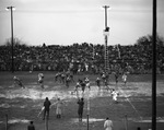 Football Game in Rain by William Rhew