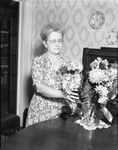 Claire Rush Ferguson with Bouquet of Flowers by East Texas State Teachers College