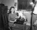 Phi Chi Member with Cat and Typewriter by East Texas State Teachers College