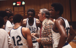 Jim Gudger with Basketball Players by East Texas State University
